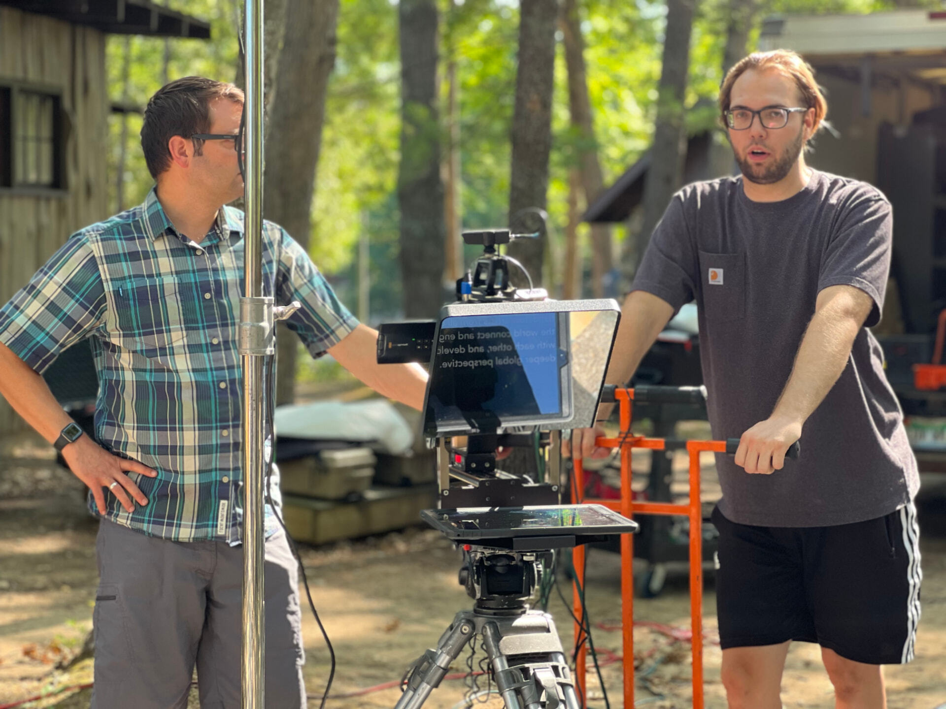 Ashton Gillett on set with a cinema camera and lighting package
